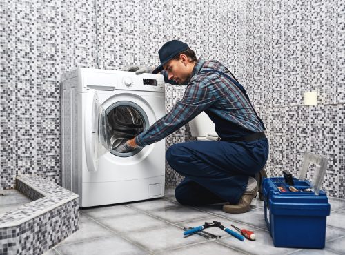 washing-mashine-is-leaked-working-man-plumber-repa-F28GS4T